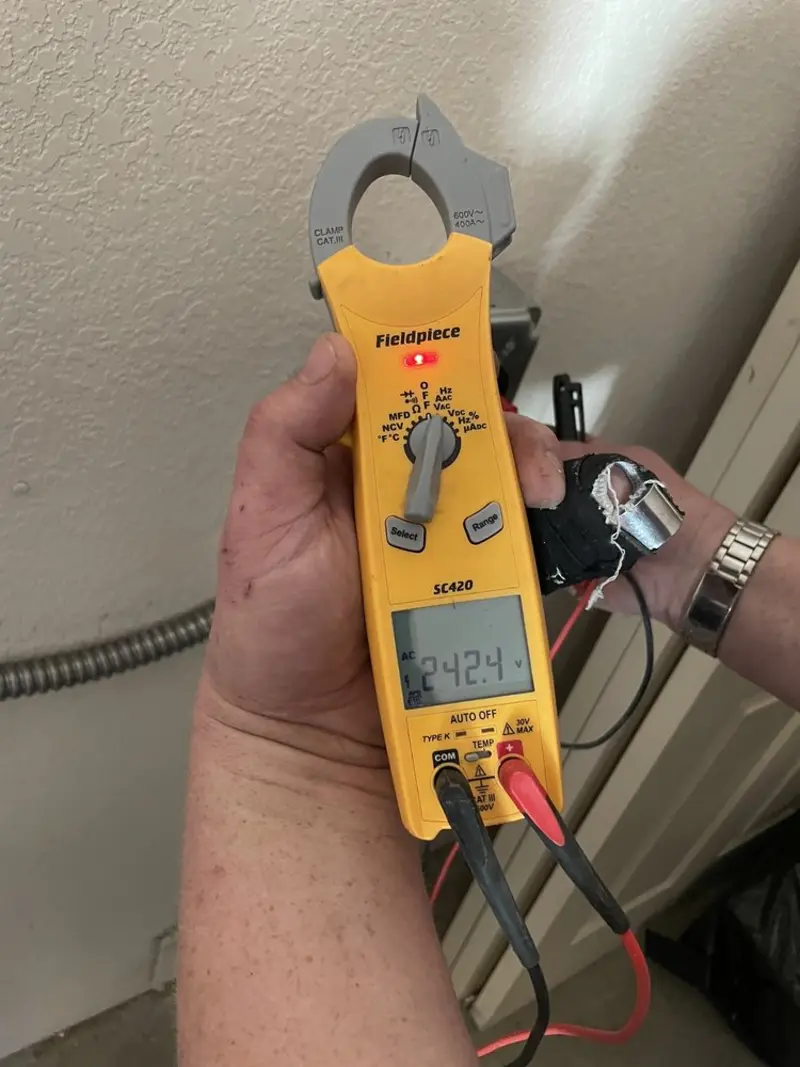 Voltage testing with clamp meter during Outlet Installation in Flagstaff